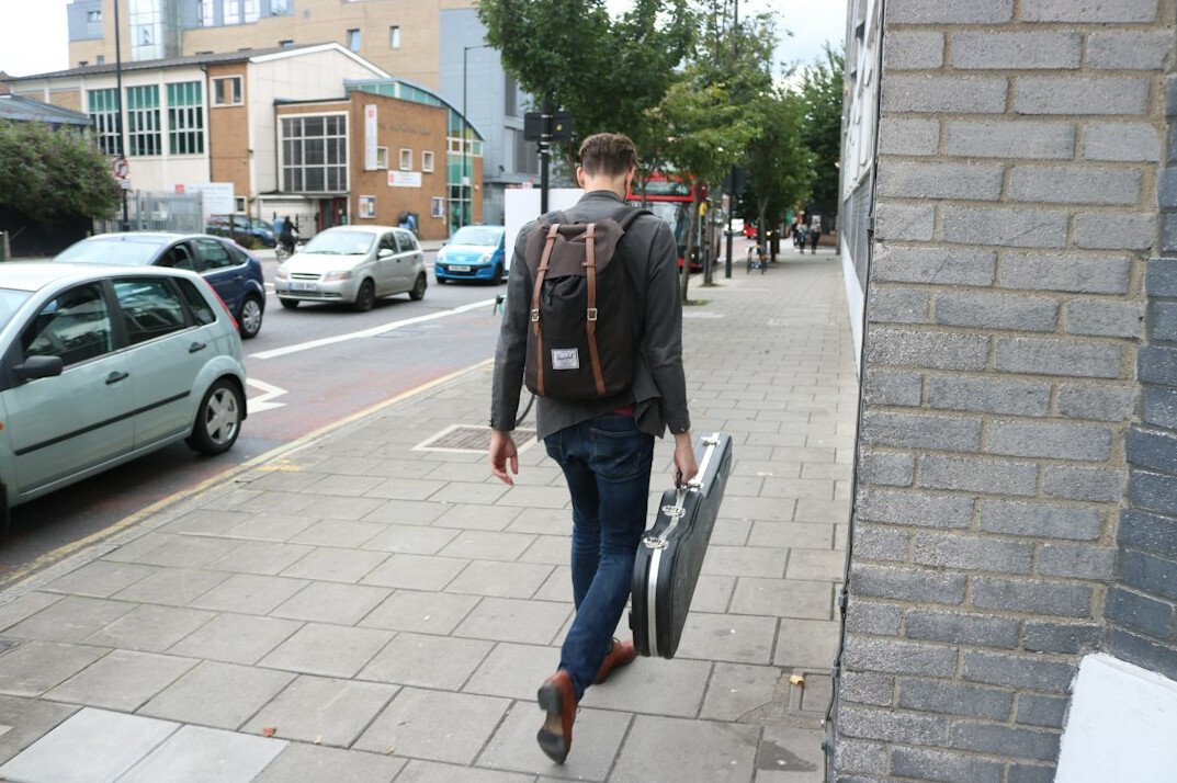 Researcher conducting a survey interview on the street